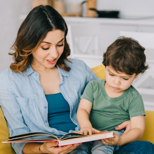 woman reading with her son